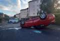 Large emergency response as car overturns 