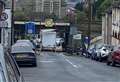 Road blocked as lorry hits bridge