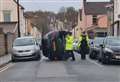 Car flips onto its side in residential street