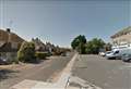 Motorcyclist wedged beneath car