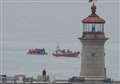 Asylum seekers in dinghy brought into harbour