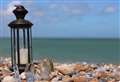 Lantern gathering on beach to mark midsummer