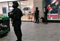 Armed police swoop on shopping centre