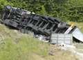 Lorry lands on roof on busy motorway