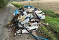 Illegally dumped waste blocks road