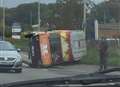 Van topples on busy road