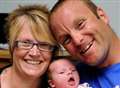 Delighted father delivers baby