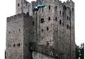 Parachuter leaps off a castle