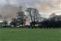 Riot police called after huge fire at barracks