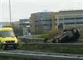 Car flips on main road