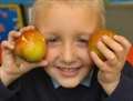 Children enjoying healthy fruit scheme