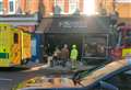 Car crashes into high street shopfront