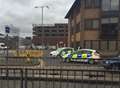 Police guard lamppost as Storm Desmond hits