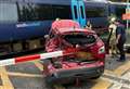 Train crashes into broken-down car on level crossing