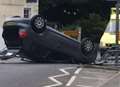 Road closure after car ends up on roof