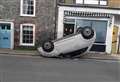 Overturned car in high street prompts emergency response