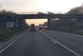 Road shut after 'distressed woman' on bridge