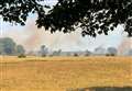 Huge fires spread across fields