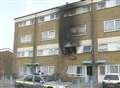 Four quizzed after family flee blaze