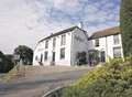 Car falls down bank outside pub