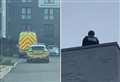 Police spotted on roof after domestic incident