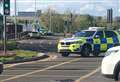 Motorbike and police car collide in town centre