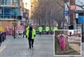 Floral tributes appear after woman’s unexplained death in town centre