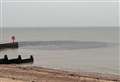 Murky water gushes into sea at beauty spot