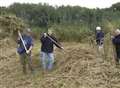 Volunteers saving rare marsh plants