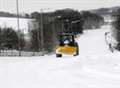 Snow drifts block roads