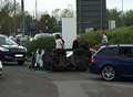 Sweeper overturns and crashes on roundabout