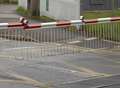 Van smashes through level crossing