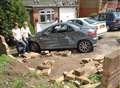 Driver smashes through garden wall after handbrake turn display