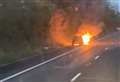 Footage shows car alight on M2 as long queues build