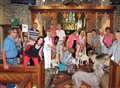 Poodle in pews with parish pets 