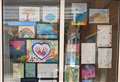 Children display homework at school's new 'Rainbow Library'