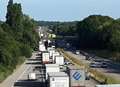 Woman 'threatens to jump' from motorway bridge