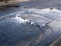 Burst water pipe closes road