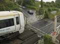 Man, 70, charged after level crossing crash