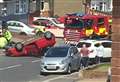 Car overturns on residential street