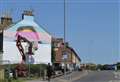 Huge mural painted on side of house