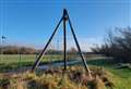 Mystery of riverside 'wigwam' made of telegraph poles