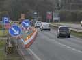 High winds blow sign off petrol station