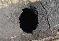 Sinkhole opens in residential street