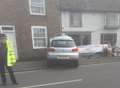 Car crashes into wall and pub