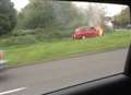 Taxi and caravan go up in flames