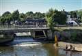 Yobs tip kayakers into river