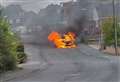 Dramatic moment car bursts into flames on residential street