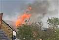 Flames tear through roof of house in suspected arson attack