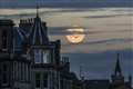 Stargazers marvel at emerging pink supermoon in skies above UK